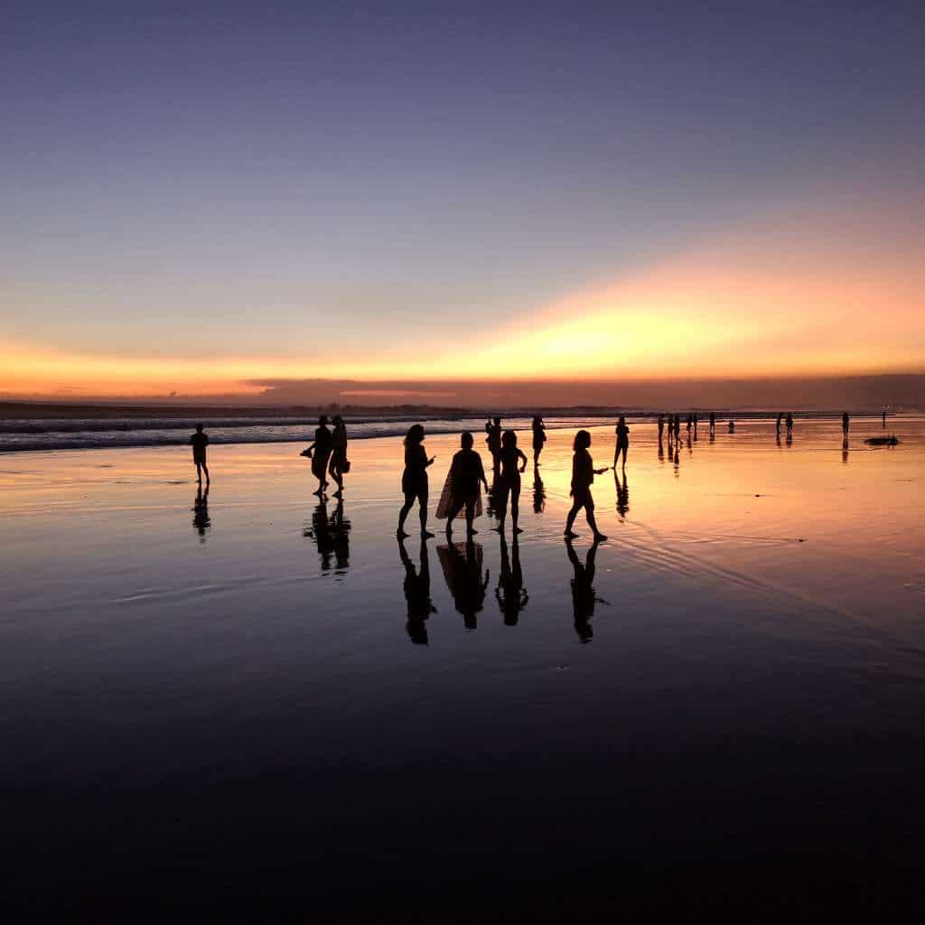 Tourist in Seminyak seeing beautiful sunset