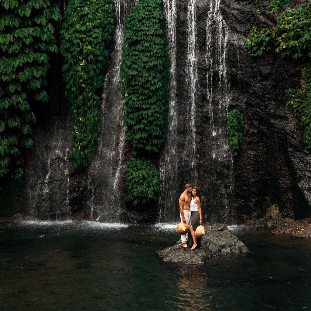 Couple poses in Beautiful Bali Waterfall