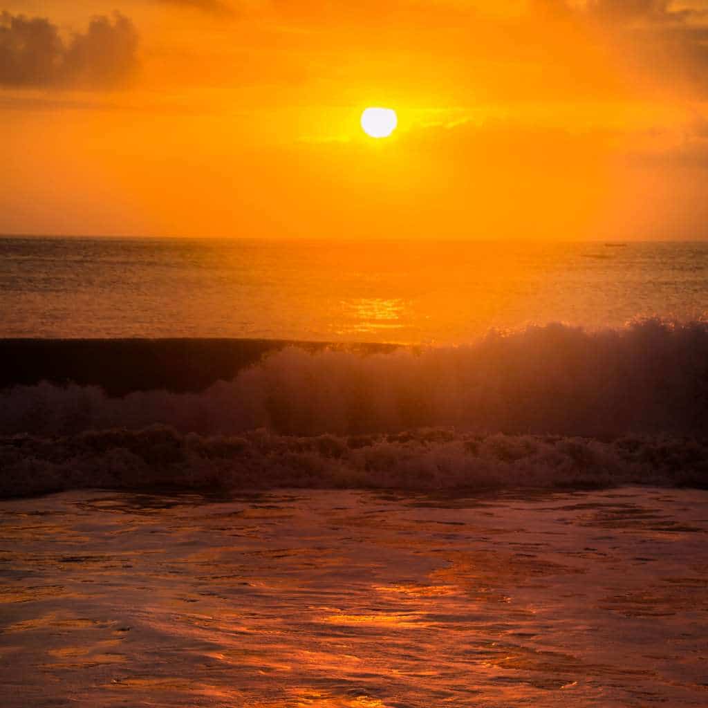 watch sunset in bali from jimbaran beach