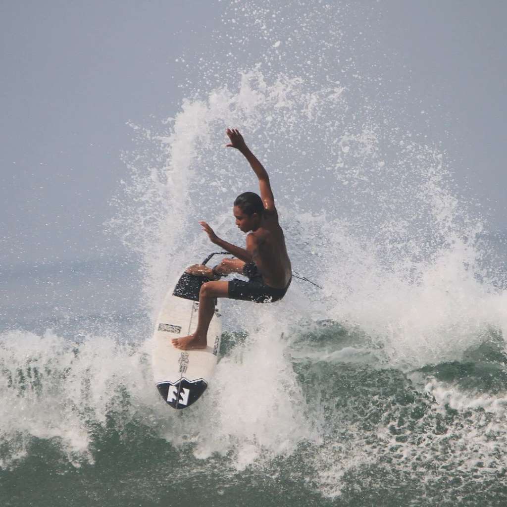 a surfer is doing surfing in pererenan beach